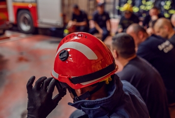Firemen lined up at the fire station