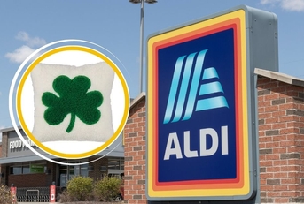 Aldi store sign with St. Patrick's Day clover pillow