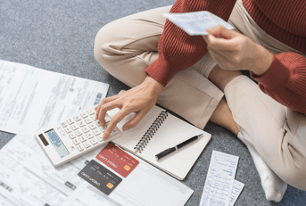 Woman with bills and credit cards