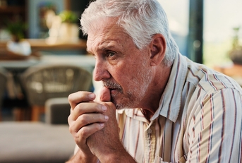 Older man looking worried