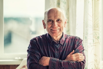 Portrait of a man in his late 60s smiling
