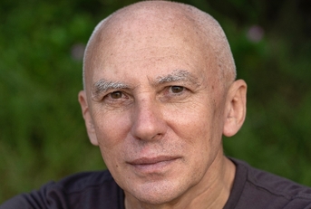 Close up of a bald man in his 60s