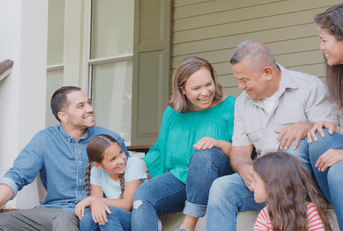 Smiling family on porch