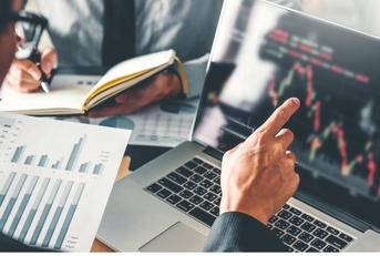 Businessmen analyzing stocks