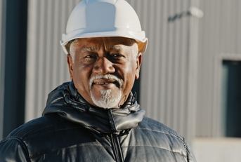 Smiling senior male construction manager