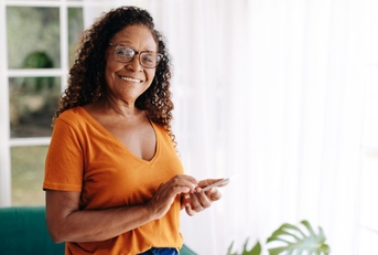 Smiling older woman in an orange top
