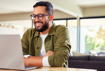 Man smiling working remotely 