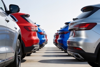 Row of colorful SUVs parked