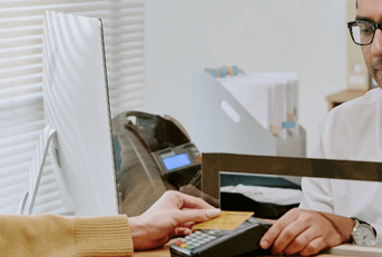 Bank teller helping customer