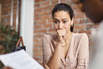 A woman nervouos at her job
