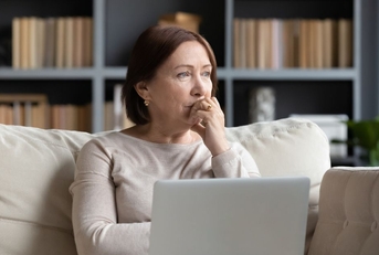 Pensive middle-aged woman