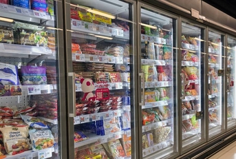 Frozen food aisle in grocery store