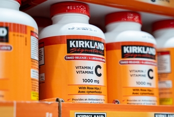 Bottles of Kirkland Signature Vitamin C on Costco's shelf