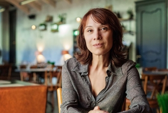 Mature woman sitting in restaurant