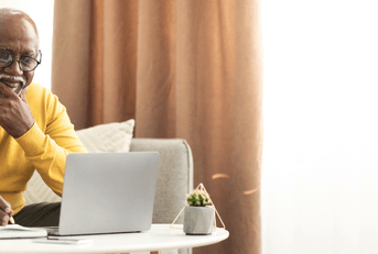 Senior man checking online benefits