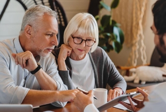 Elderly reviewing paperwork