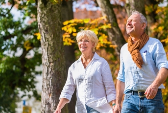 Older couple walking outdoors