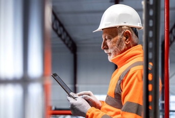 Senior male engineer in a warehouse