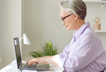 Woman sitting at home desk