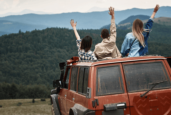 Friends enjoying view from truck