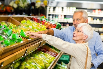 Senior couple grocery shopping
