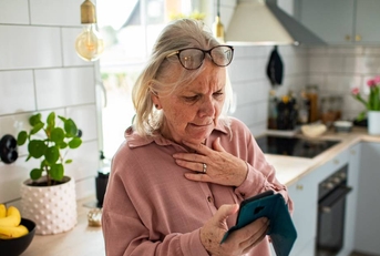 Woman with smartphone looking concerned
