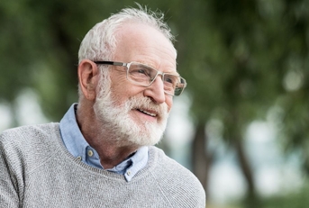 Smiling senior man in park