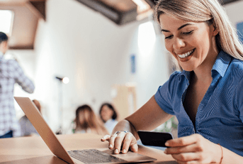 Woman on laptop with credit card