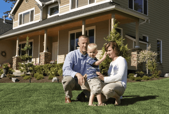 Family in front of new home