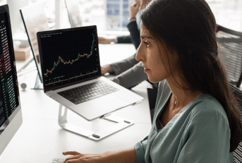 Woman checking stocks on computer