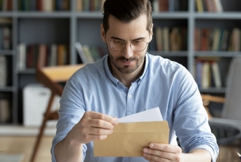 Person holding check