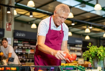 Senior working at grocery store