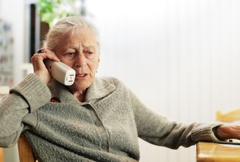 Concerned senior woman on phone
