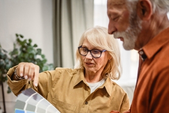 Retiree couple picking colors to remodel the house