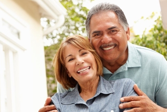 Smiling older couple in garden