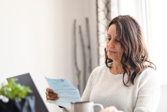 Mature woman reviewing a letter