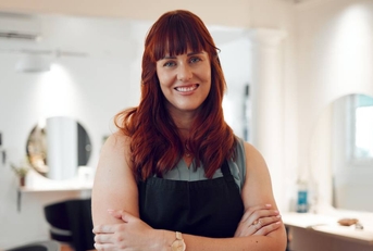 Portrait of happy hairdresser with smile