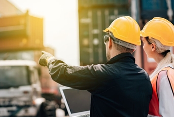 Workers in hard hats on a job site
