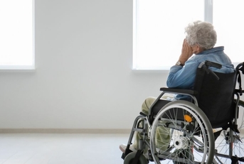 Senior woman in wheelchair indoors