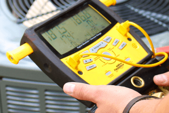Air conditioning repair man testing unit
