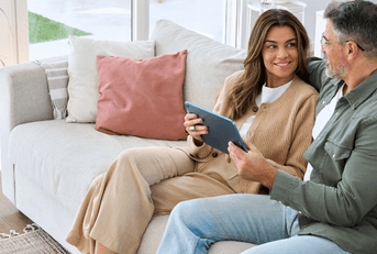 Couple on tablet researching hvac systems