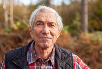 Portrait of senior man outdoors during fall