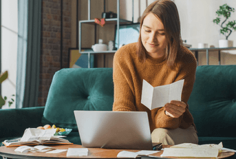 Woman doing taxes at home