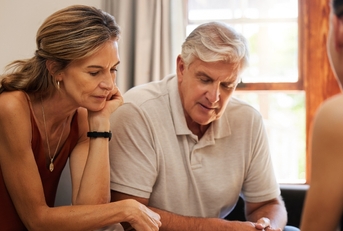 Retired couple looking at finances