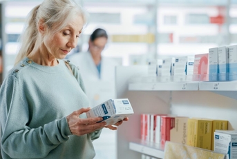 Senior woman shopping at pharmacy