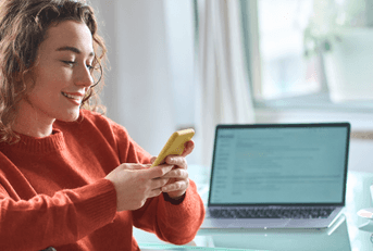 Young woman checking mobile banking on phone