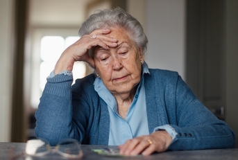 Senior woman worried about money