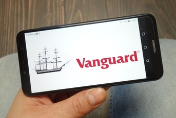 Hand holding smartphone with Vanguard on screen