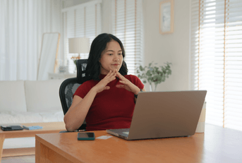 Young woman on computer reading reviews before purchasing