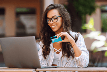 Young woman paying for an online shopping order